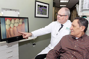 Doctor answers all questions of dental implants.