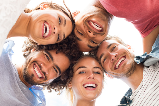 group embracing and smiling from Brush & Floss Dental Center